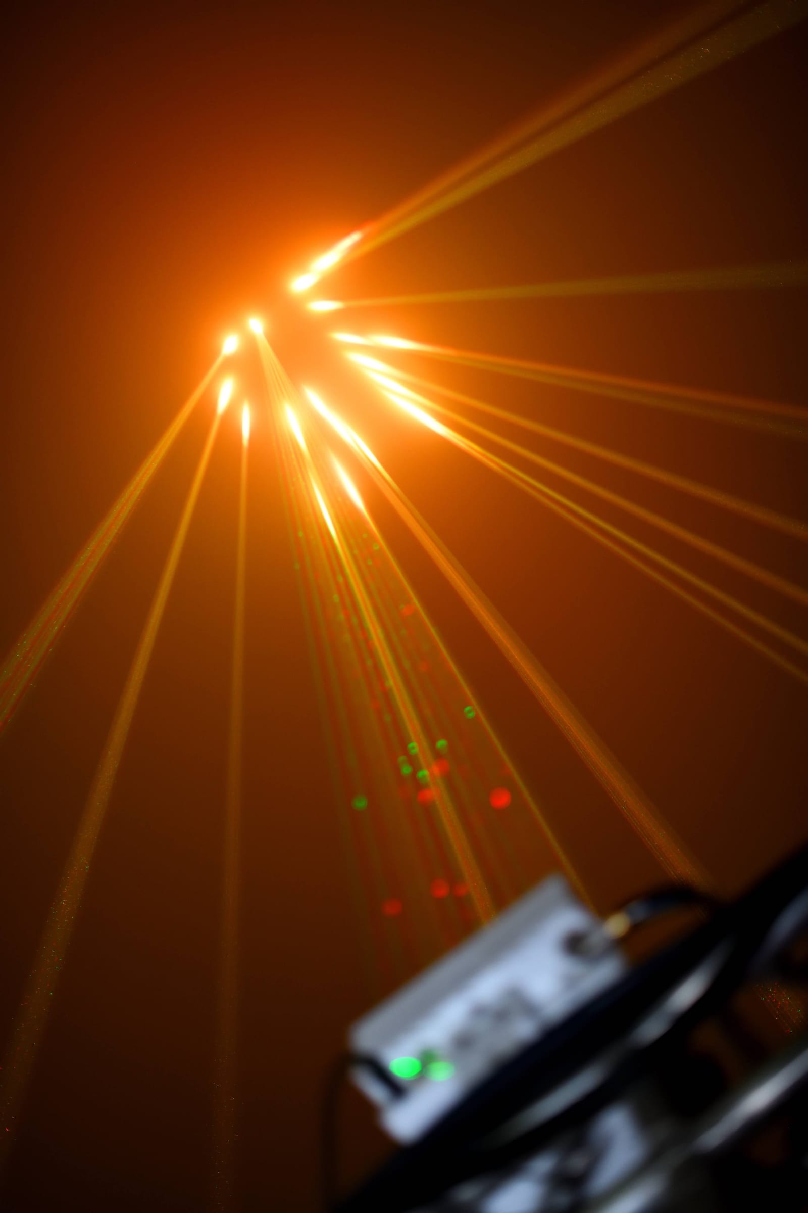Golden laser beams in the fog