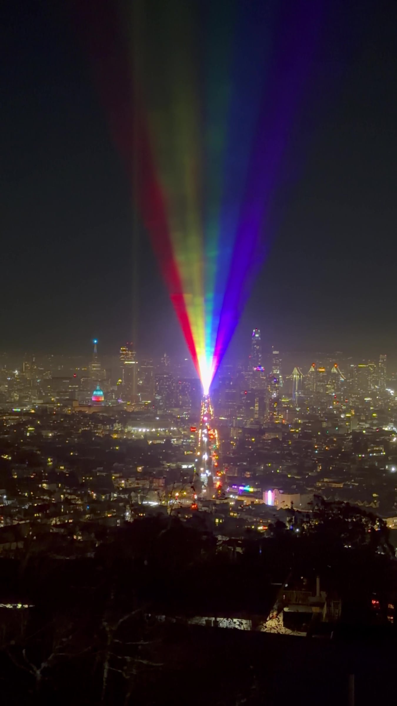 Rainbow lasers over San Francisco, seen from above